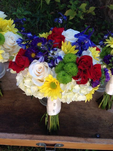 White, red, yellow, purple, and blue bouquets Blue Bouquets, Blue Flowers Bouquet, Red And Yellow Roses, White Flower Arrangements, Wedding Vows Renewal, Light Blue Flowers, Blue Bouquet, Disney Wedding, Yellow Purple