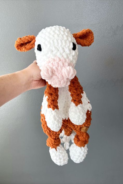 Do you have a cow lover on your hands?  This Holstein cow snuggler will fit the bill when it comes to softness and cuteness!  It's hooves and head are stuffed with an unstuffed body, which makes it a cross between a blanket and a stuffed animal. 

This snuggler is made with littles in mind.  It is 18" from head to hoof, it has embroidered eyes, and it is also easy to clean.  You can throw it in the gentle wash with your other clothes and dry on low or medium heat. Christmas will be here soon! Barnyard Nursery, Hereford Cows, Holstein Cow, Cow Toys, Ideas Birthday Gift, Holstein Cows, Embroidered Eyes, Farm Nursery, Crochet Cow