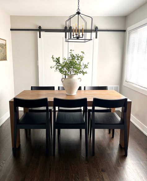 We love the way our solid wood tables look in natural lighting!⁠ .⁠ This is our Modern Dining Table in Pecan paired with our Black Solid Wood Dining Chairs. The natural light and minimalist design bring out the beautiful details of the wood to create an organic look in your space. Click the link in our bio to check out all of our dining tables, benches, chairs, and sets! ⁠ .⁠ #plankandbeam #diningroominspo #diningset #homedetails #homedecor #cottagecore #minimalistaesthetic Dining Table Black Wood, Dining Accent Chairs, Pecan Dining Table, Black Dining Room Aesthetic, Dining Room Black And Wood, Black Table With Wood Chairs, Black Kitchen Table Decor Ideas, Brown Dining Table Black Chairs, Light Wood Dining Table Black Chairs