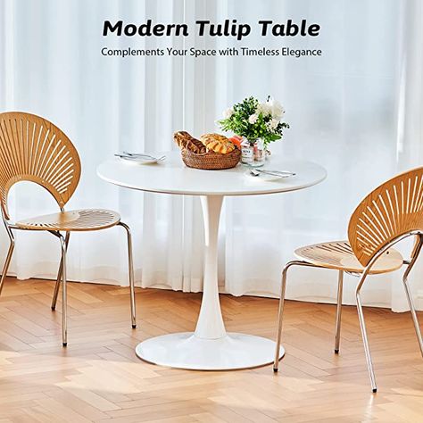 #MODERN #DINING TABLE: This round #tulip table from Vonluce offers a comfortable and #stylish #dining experience for up to 6 people, perfect for #intimate meals, family #gatherings, and friend reunions. ELEGANT STYLE: With its matte white finish, our small pedestal table adds class to your #home #decor, seamlessly blending with a variety of interior styles from #modern #minimalist to #coastal. Bistro Table Kitchen, Small Pedestal Table, Modern Square Dining Table, Mid Century Kitchen Table, Square Dining Room Table, Modern Bistro, Table For Dining Room, Tulip Dining Table, Dining Table In Living Room