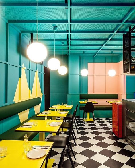 Designer: El Equipo Creativo. Space: restaurant in Madrid. The use of bold and saturated colors on the ceiling, wall, and tables, in combination with black and white checker tiles makes the space fun and memorable. It also references the visual universe created by the Spanish filmmaker Almodovar. Madrid Restaurants, Decoration Restaurant, Belek, Coffee Shop Design, Cafe Interior Design, Restaurant Interior Design, Shop Interior Design, Restaurant Interior, Cafe Interior