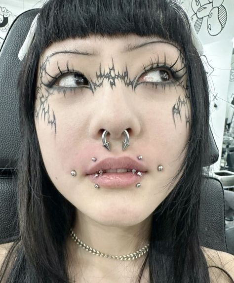 Body Modifications Piercings, Four Nose Piercings, Heavily Pierced Face, Joker Piercing, Piercing Face Ideas, Body Modification Aesthetic, Lots Of Piercings Face, Piercing Combos Face, Angel Fang Piercing