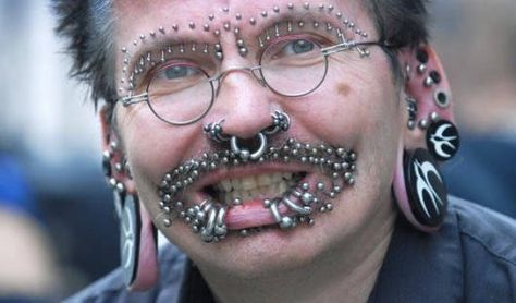 Rolf Buchholz has over 100 piercings around his face and almost 300 in the genital area. He also has a full body suit tattoo. Rolf never flies. Body Peircings, Crazy Piercings, Face Piercings, Best Tattoos For Women, Guinness Book, Facial Piercings, Face Tattoo, Body Piercings, Body Modifications