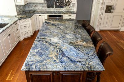 Blue Bahia Granite Kitchen Countertops - Premier Granite & Stone Blue Granite Countertops Kitchen, Blue Bahia Granite, Blue Kitchen Countertops, Blue Quartz Countertops, Gold Granite Countertops, Blue Countertops, Blue Granite Countertops, Kitchens Islands, Granite Kitchen Countertops