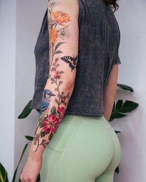 Colored Flower Back Tattoo, Full Color Floral Sleeve Tattoo, Colored Nature Tattoo, Watercolour Tattoo Sleeve, Whimsical Garden Tattoo Sleeve, Botanical Sleeve Tattoo Wild Flowers, Watercolour Flowers Tattoo, Mixed Floral Tattoo, Nature Arm Tattoos For Women