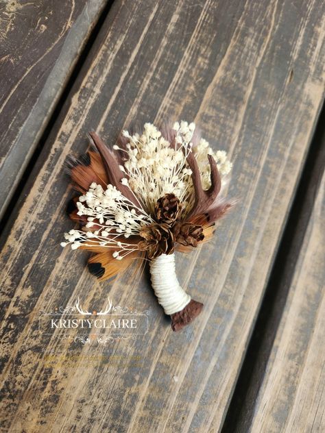 Custom Order For Racheal ❤️ Thank You! 
.
Brown Antler Boutonnieres with Preserved Babysbreath, Pampas Grass, Pinecones & Ivory Twine. 
.
WWW.KRISTYCLAIREFLORALDESIGN.COM 
WWW.KRISTYCLAIRE.ETSY.COM 
.
#weddingboutonniere #wedding #weddingideas #Antler #antlerart #brown #antlerdecor #faux #resin #pinecones #babysbreath #preservedflower #ivory #pheasant #pampasgrass #Groom #groomsmen #boutonniere #lapelpin #pin #corsage #buttonhole #idea #unique #holiday #country #barn #hunting #western #whitetail Western Wedding Corsage, Pheasant Wedding Decor, Country Boutonniere, Antler Boutonniere, Antler Wedding Decor, Pin Corsage, Antler Wedding, Groomsmen Boutonniere, Antler Art