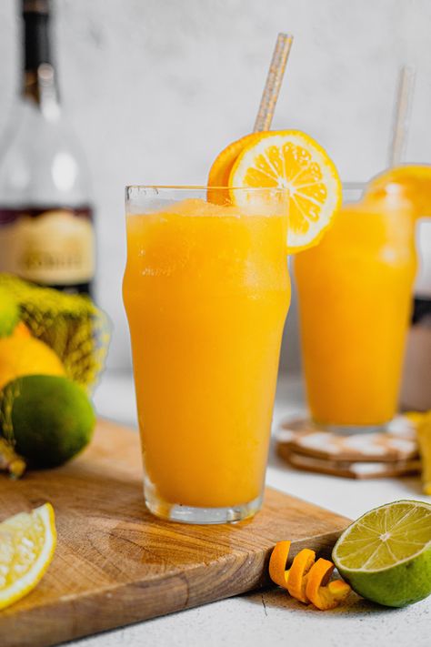 This brandy slush recipe is known far and wide across Wisconsin! It’s an easy big-batch cocktail made with tea, orange juice, lemonade, and good quality brandy. What more could you want? Brandy Slush Recipe, Brandy Slush, Homemade Orange Juice, Orange Juice Cocktails, Orange Juice Smoothie, Orange Juice Recipes, Slushy Drinks, Orange Juice Drinks, Alcohol Free Cocktails