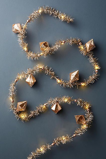 Anthropologie Blushing Tinsel Garland | Christmas Decor | Holiday Inspiration Gold Christmas Garland Ideas, Anthropologie Holiday Decor, Gold Christmas Garland, Christmas Tree Tinsel, Tree Tinsel, Pink Home Accessories, Christmas Garland Ideas, Rose Gold Christmas Tree, Rose Gold Christmas Decorations