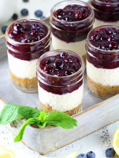 Blueberry Lemon No Bake Cheesecake Jars Recipe & Image: Cheesecake Jars On Tray Lemon No Bake Cheesecake, Cheesecake Jars, Mason Jar Desserts, Cheesecake In A Jar, Homemade Cheesecake, Dessert In A Jar, Blueberry Desserts, Mason Jar Meals, Bake Cheesecake