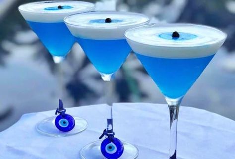 Greece Party, Clean Cocktails, Greek Dinners, Blue Drinks, Greek Restaurants, Evil Eye Beads, Eye Decor, Greek Evil Eye, Blue Cocktails