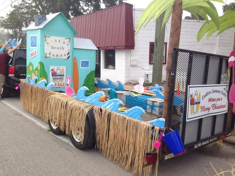 Santa’s Beach House Christmas parade float Endless Summer Realty- Saint Augustine Florida #realestate #paradefloat #cardboard Summer Themed Parade Floats, Tropical Float Parade, Beach Christmas Parade Float, Tropical Parade Float Ideas, Realtor Parade Float Ideas, Beach Themed Float, Tropical Christmas Parade Float, Beach Themed Parade Float, Beach Parade Float Ideas