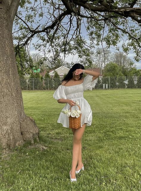 A girl holding a basket of flowers wearing a white mini dress. Cottage Core Dress Aesthetic, White Cottage Core Dress, Sundress Aesthetic, Disney Poses, Cottage Core Dresses, Modest Girly Outfits, Cottage Dress, Cute Photo Poses, Photos For Instagram