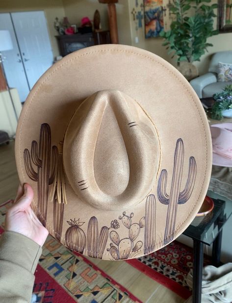 Gorgeous camel color faux suede hat, light weight and comfortable  This hat has been woodburned with a cactus design  WE WILL CUSTOMIZE this hat and add any city name in the back Burn Hats, Desert Grunge, Burnt Hat, Burnt Hats, Burned Hats, Cactus Hat, Stray Dog Designs, Hat Burning, Custom Cowboy Hats