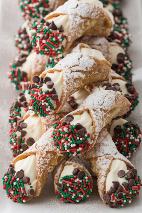 A festive display of cannoli filled with ricotta cream, dusted with powdered sugar, and decorated with red, green, and white holiday sprinkles. These traditional Italian Christmas pastries are a sweet and colorful addition to any Christmas dessert table. Italian Christmas Dessert Recipes, Christmas Wreath Dessert, Traditional Italian Desserts, French Christmas Desserts, Cannoli Recipes, Italian Christmas Desserts, Authentic Italian Desserts, Ricotta Cream, Italian Desserts Traditional