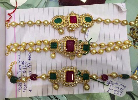 22 carat gold 2 in 1 armlet cum chokers strung with south sea pearls and beads. The pendants are studded with uncut diamonds, rubies and emeralds. Weight: 16 to 22 grams For inquiries contact on Whatsapp: +91 97 00 009000 Latest Jewellery Designs, Latest Indian Jewellery, 22 Carat Gold Jewellery, Rajputi Jewellery, Gold Temple Jewellery, Gold Jewelry Outfits, Choker Necklace Designs, Jewellery Wedding, Gold Jewelry Stores