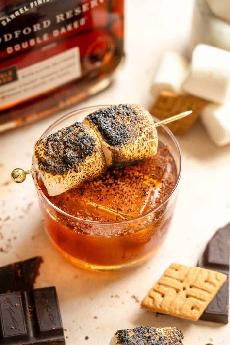 Who doesn't love a sweet gooey s'more around a campfire in the summer or fall? Well, this s'more old fashioned takes all those flavors and turns them into a delicious bourbon cocktail! It starts with a graham cracker-flavored simple syrup, then it is a good sweet bourbon, Angostura, and chocolate bitters, and finished with a toasted marshmallow. Cream Puff Dessert, Puff Dessert, Sweet Bourbon, Bourbon Cocktail, Fall Cocktails Recipes, Boozy Drinks, Bourbon Cocktails, Cocktail Desserts, Fall Cocktails