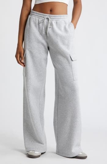 Cargo pockets and wide legs make these fleecy sweatpants right on trend for cool weather and days when you just want to be cozy. 32" inseam; 32" leg opening; 12 1/2" front rise; 13 1/2" back rise (size medium) Elastic/drawstring waist Side flap-patch pockets 68% cotton, 32% recycled polyester Machine wash, tumble dry Imported Not available for sale and shipment to Germany Cute Sweatpants, Spring Break Outfit, Wide Leg Sweatpants, Fire Fits, Cute Preppy Outfits, Grey Sweatpants, Fashion Fits, Wide Legs, Preppy Outfits