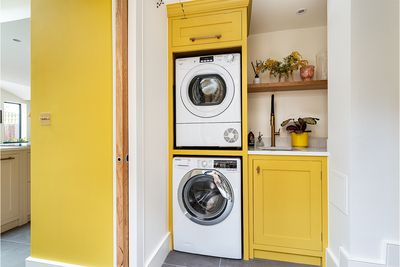 Utility Room Inspiration, Kitchen Herringbone, Galley Kitchen Renovation, Stacked Washer And Dryer, Utility Room Ideas, Yellow Laundry Rooms, Utility Room Organization, Cleaning Cupboard, Laundry Cupboard