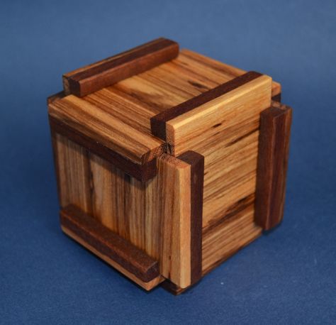 According to my blog stats a lot of people want make puzzle boxes but most of them search easy to make puzzle boxes. Unfortunately, puzzle boxes have some mechanisms and they aren't easy to make. Most of the puzzle boxes require very precise wood work. I designed this box a few days ago. I am… Puzzle Box Plans, Chinese Puzzle Box, Wood Puzzle Box, Japanese Puzzle Box, Puzzle Ideas, Mechanical Puzzles, Box Hacks, Japanese Puzzle, Wooden Puzzle Box