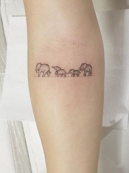 23 Meaningful Family Tattoos That Show Your Love- The Trend Spotter Tattoos For A Family Of Four, Small Tattoos For Family Symbols, Family Of Three Tatoos, Tattoo Family Of 3, Small Mother Tattoos Simple, Family Micro Tattoo, Tattoos For Your Family, Tattoos For Families, Tattoo Ideas For Family Of 3