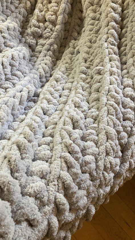 "This 12 Hour Luxurious Crochet Chunky Blanket Pattern uses big, fluffy, and sumptuous yarn to create a blanket that’s not only a joy to crochet but also a dream to snuggle under. Designed using a luxurious jumbo-weight yarn using a larger hook. Perfect to style on an accent chair, couch, or the end of your bed. Four sizes are included in the pattern. This cozy blanket is one that you’re sure to love. This blanket doesn’t just offer warmth, it envelops you in a plush embrace, akin to a ge Bulk Yarn Crochet Blanket, Finger Crochet Blanket Chunky, Fluffy Crochet Blanket Pattern, Big Blanket Yarn Crochet Patterns, Extra Chunky Yarn Crochet Pattern, Crochet Blanket Pattern Chunky Yarn, Fluffy Blanket Crochet, Chunky Blanket Pattern Crochet, Super Bulky Crochet Blanket Pattern Free