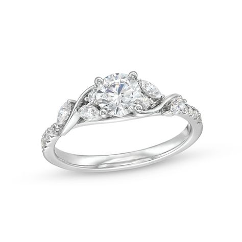 Start your love story with the elegant and charming details of this round diamond cascading vine engagement ring. Crafted in 14K white gold The 5/8 ct. round diamond sparkles at the center. A cascade of marquise-cut and round diamonds shimmers along curved vine-like ribbons. Diamonds line the shank to complete the look. This engagement ring shines with 7/8 ct. t.w. of diamonds. Swirl Diamond Ring, Pretty Engagement Rings, Cute Engagement Rings, Future Engagement Rings, Real Gold Jewelry, Classic Wedding Rings, Swirl Ring, Round Engagement Rings, Engagement Ring Shapes