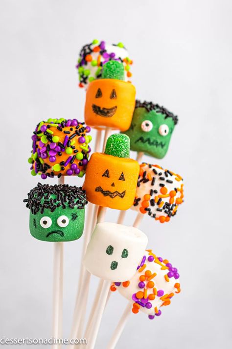 Halloween Marshmallows are so quick and easy. Make this fun and festive party treat as ghosts, Jack O Lanterns and Frankenstein. These marshmallow Halloween treats look similar to cake pops but with dipped marshmallows. It is such an easy no bake treat that is simple to transform into spooky Halloween Marshmallow Pops. #dessertsonadime #halloweenmarshmallows #halloweendesserts Marshmallow Halloween Treats, Halloween Desserts For Kids, Halloween Marshmallows, Easy Halloween Desserts, Marshmallow Halloween, Decorated Marshmallows, Dipped Marshmallows, Desserts For Kids, Halloween Sleepover