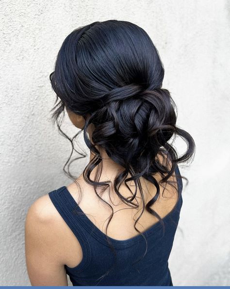 Wedding Hairstyles With Bun, Hairstyles For Wedding Guest Bun, Updo With Hair In Face, Bridesmaid Hairstyles Updo Black Hair, Barat Bun Hairstyle, Quince Low Bun Hairstyles, Low Bun With Strands Out, Romantic Textured Updo, Hair Down With Fascinator