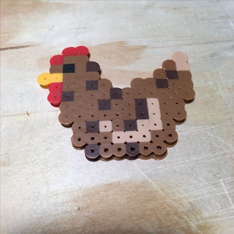 Perler melting beads chicken. Pixel art, crafts, small square board, farm animals Peeler Bead Chicken, Chicken Hama Beads, Pony Bead Chicken, Peeler Bead Animals, Chicken Perler Beads, Chicken Pixel Art, Cozy Hobbies, Melted Beads, Ironing Beads