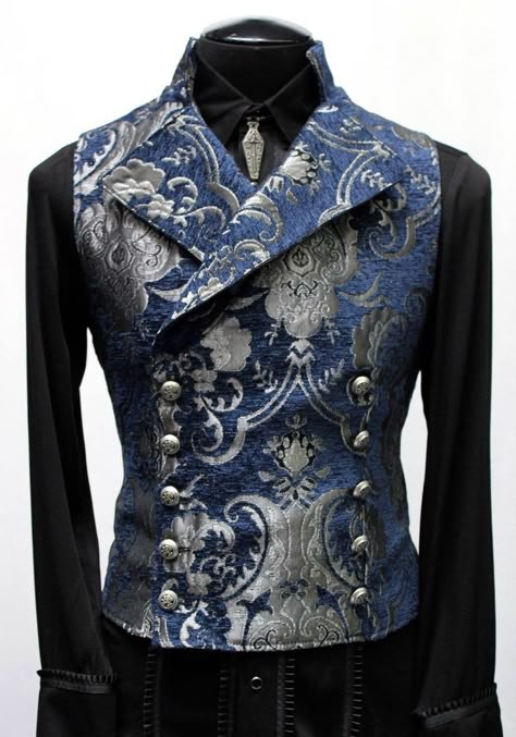 "An elegant double breasted vest for formal occasions. A fitted vest made in rich blue and silver tapestry fabric with a stand up top collar and wide sweeping lapels. Fastens on the inside with a sturdy button and buttons on the outside with five engraved metal buttons. The vest back and inside lining is made from rich black satin. Comes in sizes small-XXXL. Wonderful! Measurements: Small: Chest 39\" Stomach 36\" Waist 34\" Medium: Chest 42\" Stomach 38\" Waist 36\" Large: Chest 44\" Stomach 42\ Victorian Vest, Purple Tapestry, Fitted Vest, Double Breasted Vest, Blue Tapestry, Royal Outfits, Victorian Clothing, Tapestry Fabric, Jewelry Outfit