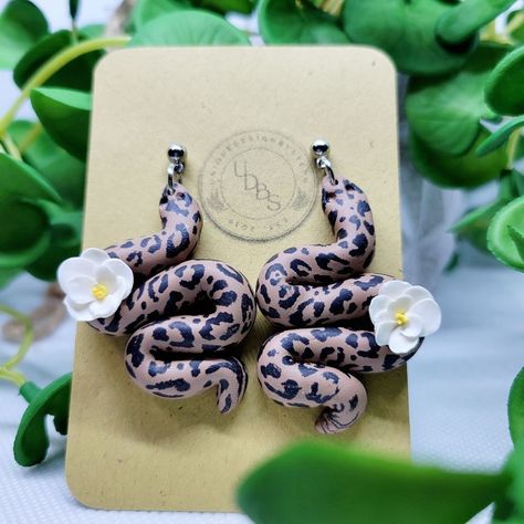 Clay Earrings, Leopard Print Snake Dangles With White Flower Accent! Ball Stud Post Dangles Lightweight Earrings Stainless Steel Hardware. Each Pair Is Handmade By Me, So Please Allow For Slight Variations. Care Instructions: Polymer Clay Earrings Are Strong And Durable, But Under Pressure My Break So Please Refrain From Forcefully Twisting And Bending Your Earrings. It Is Preferred To Store Earrings In A Separate Box Or Away From Other Sharp Objects, To Help Prevent Any Damage To The Surface Of The Earrings. Bundle And Save! Mystic Topaz Earrings, Bridesmaid Earrings Gold, Cobalt Blue Earrings, Festival Earrings, Blue Dangle Earrings, Flower Handmade, Cheetah Animal, Gold Leaf Earrings, Bridal Earrings Pearl