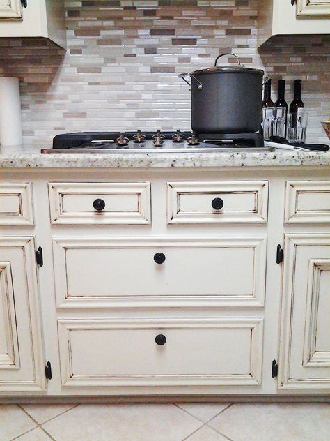 Amazing transformation from Amy of Back To Life Restoration & Home Decor! She used GF Antique White Milk Paint, an antiquing glaze then sealed them with General Finishes High Performance Topcoat in Satin. Distressed Kitchen Cabinets, White Kitchen Makeover, Chalk Paint Kitchen Cabinets, White Kitchen Renovation, Antique Glaze, Antique White Cabinets, Distressed Cabinets, Painting Kitchen Cabinets White, Stained Kitchen Cabinets