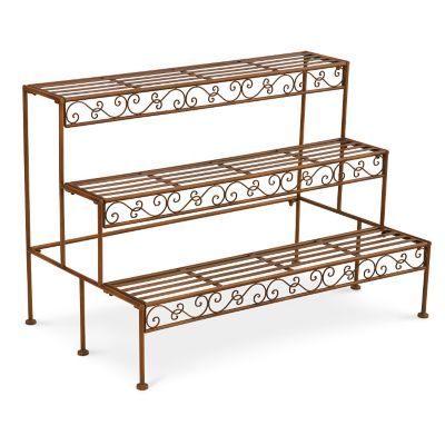 With our 3-Tier Metal Plant Racks, you have more creative options for displaying your plants.These two 3-tiered plant racks give you plenty of options for displaying your flowerpots, plants, and herbs. Use them in various combinations on your porch, patio, or 3-season room. Made of 100% powder-coated steel with an antique bronze finish, these racks feature lovely Venetian scrollwork on the front and include slated metal shelves with footed bottoms for sturdiness. Simple assembly required. St... Flower Pot Stand Outdoor, Plant Racks, Outdoor Metal Plant Stands, Plant Stand Outdoor, Outdoor Plant Stand, Nursery Plant, Garden Rack, Flower Pot Stand, Plant Rack