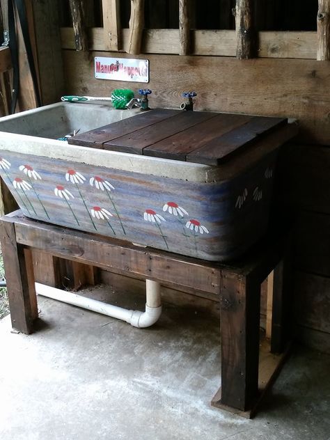 Concrete sink removed from old farm house. Put in my barn and painted for fun. I only use one side of it so I made a counter board for the other side where I store supplements. Built the stand from pallet wood and stained to bring the different woods together. Cement Sink, Outdoor Sink, Outdoor Kitchen Sink, Garden Sink, Basement Laundry Room, Basement Laundry, Laundry Room Sink, Country Kitchen Designs, Outdoor Kitchen Plans