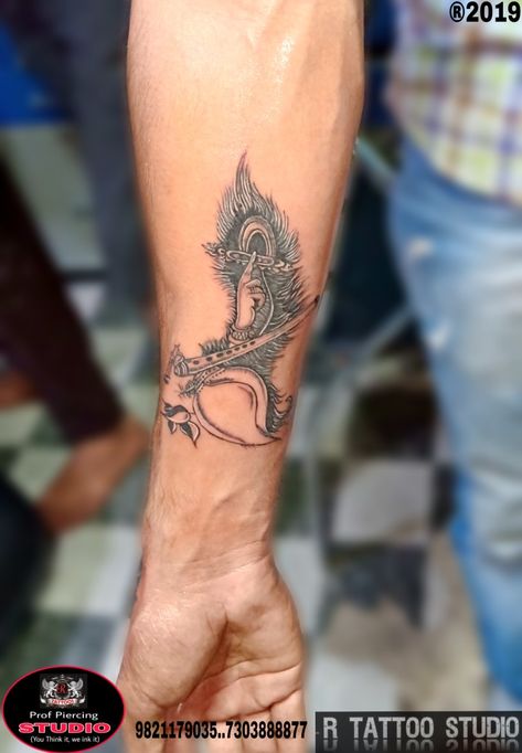 #Krishna Flute# with #Peacock feather # #shankha tattoo# done by #R Tattoo studio Krishna Tattoos For Men, Morpich Mehndi Design, Ram Krishna Tattoo, Shree Krishna Tattoo Design, Morepankh Tattoo, Krishna Tattoo Design For Men, Krishna Flute Tattoo, Shree Krishna Tattoo, Peacock Feathers Tattoo