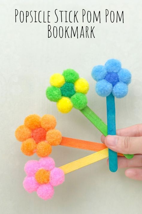 This easy popsicle stick pom pom bookmark is a great (and cheap!) way to give your kids a fun craft to make this summer! Abatelenguas Ideas, Pom Pom Bookmark, Babysitting Crafts, Craft To Make, Summer Camp Crafts, Toddler Arts And Crafts, Easy Arts And Crafts, Popsicle Stick Crafts, Daycare Crafts