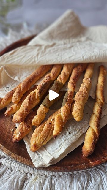 Pranomm on Instagram: "Make freshly baked parmesan bread sticks (aka soup sticks) in the comfort of your home! 

Ingredients 

1 cup all purpose flour
1/2 cup Luke warm water
1 tsp active dry yeast
1 tsp sugar
1 tbsp olive oil
1/2 tsp salt 
1/4 cup grated parmesan 
1/4 cup Semolina for dusting 
1/4 cup black & white sesame seeds 
Method
In a bowl add water, sugar, salt, oil & active dry yeast. Mix it well. Let this rest for 10 mins. 

Once the mixture turns bubbly, add in the flour & knead until everything comes together. Make sure to transfer this Dough ball into a bowl brushed with oil & cling wrap it. Rest the dough for an hour, till it doubles in size. 

Dust semolina onto the surface & transfer the dough. Spread this Dough first with hands & then use rolling pin to flatten it out. Mak Parmesan Bread, Active Dry Yeast, Bread Sticks, Cling Wrap, Dough Balls, Baking Tray, All Purpose Flour, Breadsticks, Dry Yeast