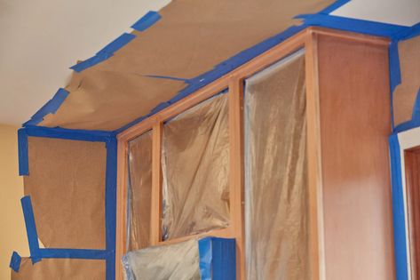 How to Spray Paint Kitchen Cabinets Taping Off Cabinets To Spray Paint, How To Spray Paint Kitchen Cabinets, Spraying Kitchen Cabinets, Spray Painting Cabinets, Spray Kitchen Cabinets, Spray Paint Kitchen Cabinets, Painting Metal Cabinets, Spray Paint Cabinets, Painting Cabinets Diy