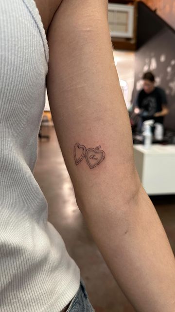 Sam’s Tattoos on Instagram: "a couple of lil locket tattoos" Heart Locket Tattoo Simple, Locket Tattoo Placement, Locket Initial Tattoo, Locket Tattoo With Initials, Love Letter Tattoo Envelope, Open Locket Tattoo, Heart Tattoo Arm, Tattoos About Mom, Valentines Tattoo