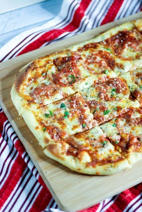 Golden crust pizza homemade on a sheet pan in the oven. An easy pizza recipe for kids, weeknight meals, and Italian pizza nights. | sipbitego.com #pizza #dinner #recipes #dough #pizzadough #italianfood #easyrecipe Pizza Dinner Recipes, Store Bought Dough, Making Pizza At Home, Kids Pizza Recipes, Sheet Pan Pizza, Store Bought Pizza Dough, Pizza Homemade, Pizza Dinner, Best Homemade Pizza