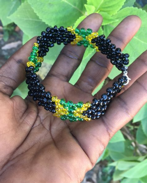 “Rep Jamaica with style! Get your unique Bracelet featuring black, gold, and green beads, symbolizing the beauty and spirit of the island. ORDERS BY: WHATSAPP Call+876-452-9986 FOR CUSTOM ORDER. Follow us on Instagram @cleantomistepentertainment_ja for more handcrafted jewelry that celebrate Jamaican culture! #Jamaican #IslandVibes #HandcraftedJewelry #SupportSmallBusiness #bracelets #braceletoftheday #artist #braceletlover #braceletshop #braceletforsale #handmadeaccessory #handmadebracel... Jamaican Bracelets, Jamaican Jewelry, Jamaican Beaded Bracelet, Jamaican Necklace, Handmade Bra, Hand-strung Multicolor Jade Beaded Bracelets, Jamaican Culture, Whatsapp Call, Gold And Green