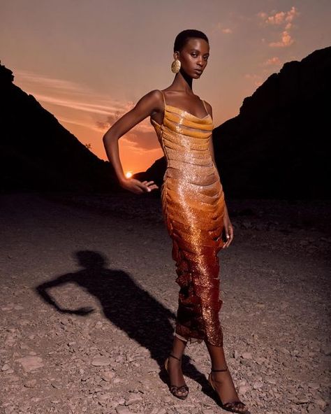 Hamda Al Fahim on Instagram: ""Sunset" -  A mesmerizing piece that captures the ethereal beauty of the sun as it dips below the horizon. A true masterpiece of haute couture.  The dress is adorned with intricate beadwork resembling the different shades  of the sunset, transitioning seamlessly into layers of beeded panels of  warm golden hues delicately to mimic the gradience of the sun in a silhouette that accentuates the figure. This  dress isn’t just a garment; it is a work of art,  a testament to the beauty &splendor of nature’s most awe-inspiring moments. #Hamdaalfahim #hautecouture" Hamda Al Fahim, Instagram Locations, Haute Couture Dresses, Ethereal Beauty, The Horizon, The Sunset, Beaded Dress, Couture Dresses, Awe Inspiring