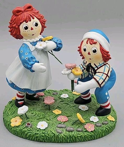 This delightful Raggedy Ann and Andy Collectible Figurine is a must-have for any fan of these beloved cartoon characters. Made in 1998 by the Danbury Mint, this original and authentic figurine is a charming addition to any collection. With its multicolor design and intricate details, this figurine is perfect for all occasions. Whether as a gift for a loved one or as a centerpiece in your own collection, this Raggedy Ann and Andy figurine is sure to bring joy and nostalgia to all who see it. Photos are part of my description. Please carefully review it. It Photos, Raggedy Andy, Raggedy Ann And Andy, Danbury Mint, Raggedy Ann, Intricate Details, Collectible Figurines, Cartoon Characters, Figurines