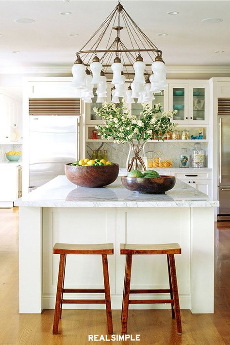 Gorgeous Kitchen Island Ideas for Every Home | If you are lucky to have a large kitchen, turn it into the “command center” of the house, where all the action takes place, from cooking to hanging out to doing work on your laptop. This kitchen island becomes a multifunctional space everyone can gather around, which makes for more relaxed family time. #kitchenideas #trending #detail #interiordesign #decorideas #realsimple #kitchendecortrends #details Multipurpose Kitchen Island, Kitchen Decor Trends, Kitchen Island On Wheels, American Farmhouse Style, Rustic Kitchen Island, Small Kitchen Island, Farmhouse Kitchen Island, Kitchen Island Decor, Large Kitchen Island