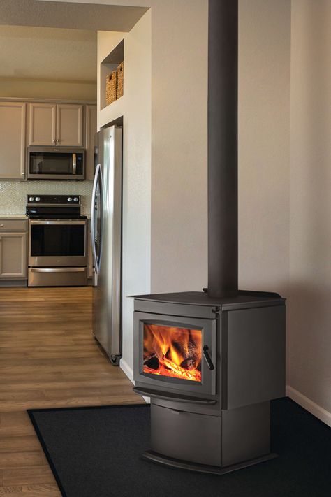 Clean lines and contemporary style - Napoleon S20 wood burning stove is the perfect choice for wood heating. #napoleonfireplaces #napoleonwoodstove #FireplacePro #contemporarystyle #woodheat #homeideas #fireplace #freestandingfireplace #woodstove Ranch Fireplace, Franklin Stove, Fireplace Wood Burning, Farmhouse Reno, Stove Decor, Wood Burning Stoves Living Room, Napoleon Fireplace, Stove Ideas, Standing Fireplace