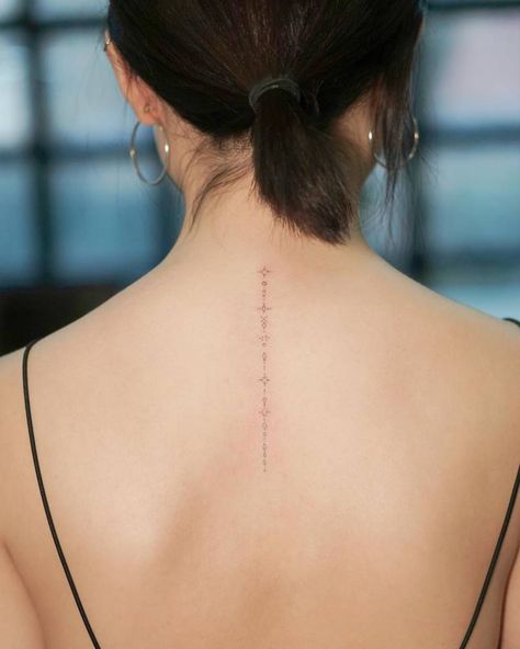 Subtle Spine Tattoos For Women, Small Fine Line Back Tattoo Women, Back Of Neck Spine Tattoo, Symbol Chain Tattoo, Fine Line Back Of Neck Tattoo, Star Tattoo Spine, Spine Tattoos For Women Fine Line, Fine Line Spine Tattoos, Spine Tattoo Stars