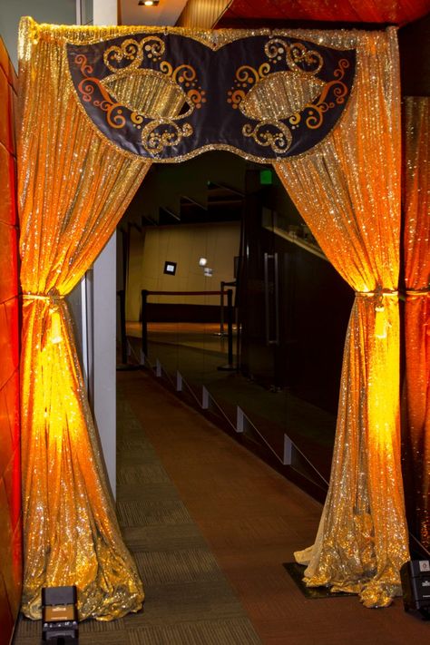 Masquerade Party Setup, Blue And Gold Masquerade Party Decorations, Big Masquerade Mask Decoration, Red Carpet Masquerade Party, Masquerade School Dance Decorations, Carnival Masquerade Party, Masquerade Entrance Decor, Masquerade Theme Decorations, Masquerade Party Decorations Theme Entrance