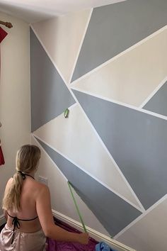 How to paint a geometric wall in a teenagers bedroom. This tutorial explains step by step how to do DIY paint decor using geometric shapes and frog tape. We used a grey and cream colour scheme for a cool bedroom wall ideas. Bedroom Paint Design, Teenagers Bedroom, Geometric Wall Paint, Wall Paint Patterns, Paint Decor, Wall Painting Living Room, Diy Wall Painting, Room Wall Painting, Bedroom Wall Designs