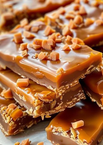 These Butterfinger Caramel Crunch Bars combine layers of caramel, chocolate, and crushed Butterfinger candy on a graham cracker crust. With just 10 minutes of prep, this easy dessert is perfect for holidays, parties, or anytime you need a sweet treat! Rich, crunchy, and full of flavor, these bars will be a hit with friends and family. Save this pin and try them out today! 🍫🍬 Bomb Bars Dessert, Butterfinger Caramel Crunch Bars, Dessert For Party, Coffee Fudge Recipes, Butterfinger Bars, Crunch Bars Recipe, Desert Bars, Butterfinger Candy, Crunch Bars