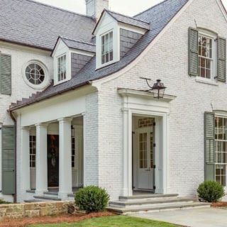 20 Favorite Exterior Paint Colors + Doors and Trim | Laurel Home Limewash Brick With White Siding, White Brick French Country Exterior, White Brick And Stone Exterior, Brick Whitewash, Whitewash Brick House, White Brick House, Lime Wash Brick, Boxwood Landscaping, Painted Brick Exteriors